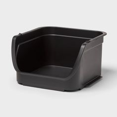 a black plastic container sitting on top of a white surface