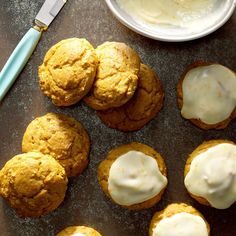 several cookies with white icing on a table