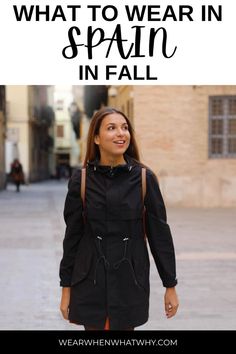 a woman walking down the street with text overlay that reads what to wear in spain in fall