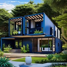 a blue container house surrounded by trees and plants