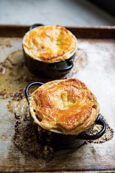 two pot pies sitting on top of a pan