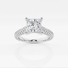 a princess cut diamond ring with pave set shoulders