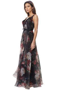 a woman in a long dress with flowers on it