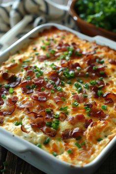 a casserole dish with bacon and green onions