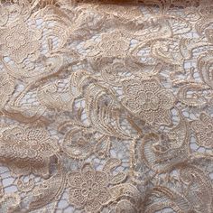 an image of lace fabric with flowers on it