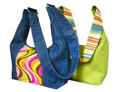 two purses one green and one blue with multicolored stripes on them, the other made out of denim