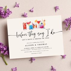 a card with drinks on it and purple flowers around it, says before they say i do let's have a drink at two