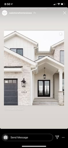 a white house with black doors and windows