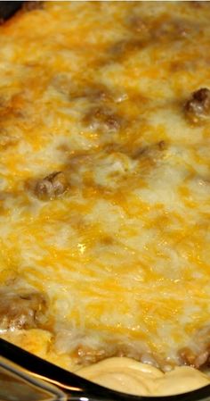 a casserole dish with cheese and meat in it