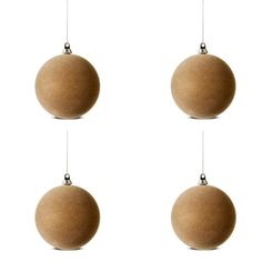 three brown balls hanging from strings against a white background