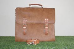 A cowhide hairon leather laptop briefcase case bag is a type of laptop bag made from cowhide leather that features hair-on patterns on the surface. It typically has a spacious main compartment with a padded section to protect a laptop, as well as additional pockets and compartments for storing other items such as documents, pens, and accessories. The bag is designed to be carried using handles or a shoulder strap and provides a stylish and durable option for carrying a laptop and other essential Luxurious Hair, Briefcase Bag, Laptop Briefcase, Bags Aesthetic, Leather Laptop, Laptop Bags, Brass Buckle, Chic Accessories, Leather Pulls