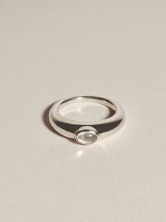 A punctuating 4x6mm oval quartz cabochon stone, bezel set on a graduated and full round solid band.The Glacé Ring I is part of our classic Glacé Collection, pairing solid, 100% recycled 14k gold or sterling silver with clear quartz; equal parts modern statement and a relic that could belong to any era. Exploring the limits of shape through our signature lens of timelessness and wearability, our Glacé collection includes both our permanent clear quartz styles and evolving capsules incorporating l J Hannah, Jewelry Lookbook, Rare Gemstones, Jewelry Inspo, Dream Jewelry, Piercing Jewelry, Cute Jewelry, Clear Quartz, Precious Stones