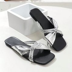 Expertly crafted for your summer wardrobe, our Chic Bowknot Square Toe Flat Sandals will be your go-to staple for 2024. The unique bowknot design adds a touch of elegance, while the square toe offers a comfortable fit. Don't miss out on the ultimate summer essential. Color : Silver Style : Glamorous, Fashionable Pattern Type : Colorblock, Plain Toe : Open Toe Details : Rhinestone, Braid Size Fit : True To Size Upper Material : PU Leather Lining Material : PU Leather Insole Material : PU Leather Trendy Synthetic Sandals With Bow, Black Bow Sandals For Summer, Trendy Beach Sandals With Bow, Casual Summer Sandals With Bow, Casual Bow Sandals For Summer, Beach Open Toe Sandals With Bow, Flat Sandals With Bow For Summer, Trendy Bow Sandals For Spring, Trendy Spring Sandals With Bow