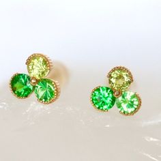 Sapphire Trio Stud Earrings in 14Kt YELLOW  Garnet Minimal Trio Studs Push Back Earrings Green Stud Measurement: 5.5mm*5.5mm - 6* 2.7mm Natural Round Brilliant Cut Neon Green Tsavorite Garnet - Measurement: 5.5mm*5.5mm - 14k Yellow Gold Push back style with Silicone Backing - All Stones are Ethically Sourced - Natural Stones May Slightly Vary in Color 7-day return accepted. This item will be sent in well-made velvet jewelry box Please feel free to browse my shop for additional pieces of certifie Yellow Gold Tsavorite Gemstone Earrings, 14k Gold Jewelry Set With Green Matching Earrings, Gold Tsavorite Gemstone Earrings, 14k Gold Green Earrings, Hallmarked 14k Gold Green Earrings, 14k Gold Green Pierced Earrings, Yellow Gold Tsavorite Earrings Fine Jewelry, Hypoallergenic 14k Gold Green Jewelry, Hypoallergenic Green 14k Gold Jewelry