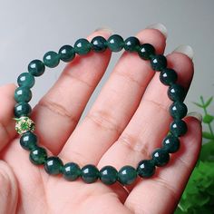 Product Details Product name: Jade bracelet Material: natural jade Shipping/Standard Handling and Shipping Requirements (15-30 days) Color: dark green Gloss: glass gloss Condition: Brand new Green Jade Crystal Bracelet For Meditation, Green Agate Round Crystal Bracelet, Green Jade Beaded Bracelets For Meditation, Green Round Beads Crystal Bracelet For Meditation, Green Jade Crystal Bracelet With 8mm Beads, Green Agate Hand-strung Crystal Bracelet, Green Crystal Bracelet With Polished Beads, Jade Bracelet, Natural Jade