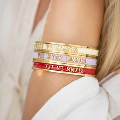 ♥ Personalised Roman Numeral Date Bangles ♥ handmade with bespoke dates ♥ Valentines Gift ♥ Anniversary Present ♥ Wedding Day Jewellery ♥ 30th Birthday Gift, 40th Birthday Gift, 50th Birthday Gift or 60th Birthday Gift ♥  These bracelets come in Gold, Silver or Rose Gold with a range of enamel colours (see picture for full range).  Key information: ► Small size has a 5.9cm diameter / 18.50cm Circumference (slides over whole hand - does not open up!) ► Regular size has a 6.4cm diameter / 20.10cm Luxury Wedding Bracelets For Valentine's Day, Wedding Bangle Jewelry With Hallmarks, Classic Rose Gold Name Bracelet For Wedding, Gold Bangle For Anniversary On Valentine's Day, Hallmarked Bangle Bracelets For Wedding, Wedding Bangle Bracelet With Hallmarks, Gold Name Bracelet For Wedding, White Name Bracelet For Wedding, Elegant Wedding Bangle For Valentine's Day