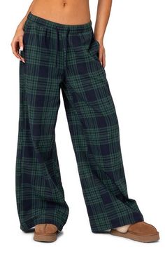 Feel the comfort of these cozy cotton-blend sweatpants updated with wide legs and finished in a laid-back plaid. Elastic/drawstring waist Front slant pockets 50% cotton, 50% polyester Machine wash, dry flat Imported Comfy Pants With Pockets, Orange Pajamas Pants, Plaid Slant Pocket Pants, Sweatpants Where To Buy, Womens Pajamas Set Pants, Pj Theme Football Game, Womens Fleece Lined Pants, Womens Comfortable Pants, Low Rise Plaid Pants Outfit