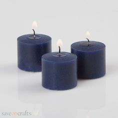 three blue candles are sitting side by side