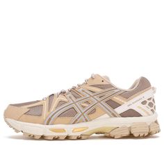 the asics running shoe in beige and silver