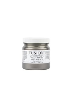 a jar of metallic paint sitting on top of a white surface with the words fuson written