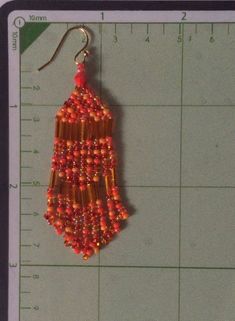 Seed bead fringe dangle earrings made with mirror bright metallic bugle beads and bright orange 11/0 seed beads. These super bright earrings have gold plated earwires. These earrings are small in size with big, bold colors. They measure just under 3 inches long (7.62cm). Perfect anytime and fun to wear. All items are handmade and shipped promptly. Please allow extra time when ordering multiple items. Thanks for looking and please stop by again. Returns are gladly accepted on all earrings. Please Orange Beaded Fringe Earrings With Round Beads, Orange Beaded Fringe Dangle Earrings, Orange Beaded Earrings With Gold Round Beads, Bead Fringe, Bugle Beads, Please Stop, Beaded Fringe, Beaded Dangle Earrings, Seed Bead Earrings