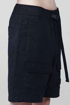 With an elastic waistband and plenty of pockets, the Liquid Tech Shorts are a seamlessly practical addition to any look. 100% Cotton Lining: 100% Polyester Elastic waist short with adjustable waist and zipper fly Front cargo pockets Team Liquid embroidery on front left pocket and 1 patch pocket on back Front zippered welt pockets Imported SHIPPING Based on demand, items may take 1-2 weeks to ship. Navy Bottoms With Pockets For Outdoor Activities, Navy Outdoor Pants With Pockets, Navy Bottoms With Pockets For Outdoor, Navy Outdoor Bottoms With Pockets, Techwear Cargo Bottoms Short Length, Techwear Bottoms With Cargo Pockets, Black Nylon Cargo Shorts With Pockets, Black Nylon Cargo Shorts With Side Pockets, Techwear Style Cargo Bottoms Short Length