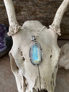 Oval shaped moonstone surrounded by hand made sterling balls and hangs from a 5mm rolo chain that is adjustable up to 18" "Moonstone looks like a big moon in the night sky. Color and light shifts with the iridescence and there is a fluid and watery movement to the stone. The appearance is also soft and milky, like mother's milk. Moonstone is a natural crystal mineral that is thought to harvest the energy of the moon. Similarly, this stone promotes positive well-being and balance, and enhances yo Oval Moonstone Gemstones With Spiritual Style, Spiritual Oval Moonstone Necklace, Oval Moonstone Cabochon Pendant Jewelry, Spiritual Silver Oval Pendant Gemstone, Spiritual Moonstone Nickel-free Necklace, Big Moon, Mother Milk, Moon Cycles, Oval Pendant