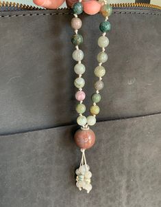 Handmade gemstone mala-inspired purse/zipper charm--it can also be added to rearview mirrors, hanging plants, office areas, and many other things!  This gemstone charm has been created by me in the style of mala necklaces with doubled extra strength nylon cord, and a knot tied between each authentic gemstone bead.  A 2" o-ring carabiner in complementary metal will be included so you can immediately attach this to whatever you wish. This charm is made from natural 8mm India agate and labradorite Healing Beaded Necklaces With Round Stones, Spiritual Beaded Necklaces For Meditation, Spiritual Stone Beaded Necklaces For Meditation, Spiritual Pendant Beads With Natural Stones, Bohemian Jade Beads With Natural Stones, Natural Stone Beads For Meditation, Natural Stones Meditation Beads, Bohemian Beaded Necklaces With Round Beads For Everyday, Multicolor Round Beads Necklace For Everyday