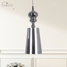 The Ilaria Metal Cone Pendulum Light epitomizes simplicity and elegance. With its sleek design and metallic finish, this pendant light is a perfect addition to any modern or contemporary space. The 1 head hanging pendant features a cone-shaped metal shade that exudes a warm and inviting glow. Available in both silver and gold, you can choose the one that best complements your dÃ©cor. With three different width options of 6, 8, and 10 inches, this pendant light allows you to customize the size according to your preference and the available space. Illuminate your living room, dining area, or bedroom with this stunning pendant light and create a stylish ambiance that is both chic and sophisticated.Size: 6" 8" 10" Fixture Width: 6" 8" 10" Fixture Height: 18.5" 23" 31.5" Bulb Included: No Numbe Pendulum Lights, Fluorescent Light, Hanging Pendant, Hanging Pendant Lights, Silver Style, Design Silver, Hanging Pendants, Mid Century Style, Contemporary Decor