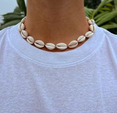 Step out in classic surfer style with our Coco Necklace! This set features a cool brown cord that matches any coastal outfit.  Cream Lacquered Cowrie Shells Wax Cord approx 16" with adjustable 7" knot - adjustable and waterproof! Matching anklet and bracelet!  Mix and match with your favorite HALT pieces or wear alone for boho beach vibes. The perfect gift for her! Our jewelry is handmade in the Sunshine State with local materials and shipped with an effort to use environmentally friendly packaging, making it the perfect choice for those who shop with a green mindset. Coco Necklace, Outfit Cream, Cool Brown, Coastal Aesthetic, Vacation Accessories, Surfer Style, Cowrie Shells, Cowrie Shell, Sunshine State