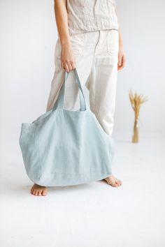 "Large linen bag for a long-awaited summer holiday, picnic, or trip to the beach. Made of soft heavyweight linen that feels lovely to the touch. Roomy enough to carry large towels along with other essentials. The bag has an extra linen lining so it can withstand heavier items. * Which is your favorite color? Ocean / Olive / Terracotta. Beach bag approx. size: Height: 35 cm / 14\" Length: 45 cm / 18\" Width: 22 cm / 9\" Handles: 26 cm / 10\" (Strap drop length) \"Custom size available. Please wri Summer Cotton Weekender Bag For Everyday, Cotton Weekender Bag For Everyday Summer Use, Summer Beach Shoulder Bag With Pockets, Summer Cotton Tote Weekender Bag, Blue Summer Tote Canvas Bag, Summer Blue Canvas Tote Bag, Blue Summer Bags With Pockets, Summer Blue Bags With Pockets, Eco-friendly Linen Shoulder Bag For Beach