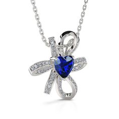 Stunning and fashionable, this necklace will capture her heart at first sight with its incomparable brilliance. Crafted in sterling silver, this piece features a blue heart-cut stone at the center of a knot of beautiful lines of white shining stones. Your love brightly radiates in every sophisticated detail of this tailored unmatched necklace that delivers feminine elegance and glamour. This design is an accessory that she will love to wear day after day.Carat Weight: 2.3 ctStone Size: 7*7 mmSto Feminine Elegance, Beautiful Lines, Love Knot, Blue Heart, 7 And 7, Sterling Silver Necklace, Sterling Silver Necklaces, Bespoke, Knot