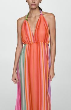 Colorful stripes splash bright energy onto this maxi-length sundress with a stunning open back. Ties at neck Halter neck Adjustable tie straps Lined 100% polyester Machine wash, line dry Made in Turkey Vibrant Summer Maxi Dress, Chic Multicolor Maxi Dress For Beach Party, Chic Multicolor Maxi Dress For Beach Cover-up, Chic Multicolor Maxi Dress For Summer Parties, Multicolor Backless Dress For Beach Party, Multicolor V-neck Halter Dress For Vacation, Chic Multicolor Summer Beach Dress, Striped Bohemian Maxi Dress For Summer, Bohemian Striped Maxi Dress For Summer