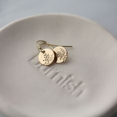 "Dainty, petite gold filled hand stamped botanical disc earrings, paired with French-style earwires. Hand stamped with a minimalist wildflower design, these petite dangle earrings are a customer favorite because they are lightweight, but not flimsy. All in 14K gold filled metal for long lasting quality. * Mini discs are 3/8 inch. * Overall earring length is about 0.75 inches. * All components are 14K gold filled. * French-style standard ear wires with clear stoppers.  * Handcrafted with love in Gold Earrings With Flower Charm For Everyday, Everyday Gold Earrings With Flower Charm, Delicate Flower Charm Earrings For Everyday, Minimalist Everyday Earrings With Flower Charm, Everyday Minimalist Earrings With Flower Charm, Delicate Gold Flower Earrings For Everyday, Minimalist Nickel Free Flower Earrings For Everyday Wear, Gold Minimalist Flower Earrings For Everyday, Gold Round Flower Earrings For Everyday