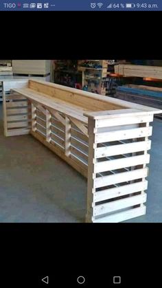 a counter made out of wooden pallets in a shop