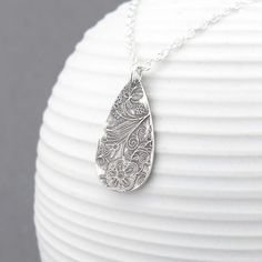 A bohemian style handmade Sterling Silver teardrop, textured with my Enchanted Garden pattern, is one inch in length and suspended from a delicate 1.9mm Sterling Silver cable chain. The teardrop has been antiqued to a dark black, buffed and tumbled polished and the chain is shiny silver. Please note that the texture on each teardrop will vary slightly as each one is created one at a time by my own two hands. Sterling Silver Teardrop: 1 inch Chain Length: Please choose at checkout. Matching earri Bohemian Sterling Silver Pendant Drop Necklace, Handmade Bohemian Teardrop Necklace, Bohemian Teardrop Sterling Silver Drop Necklace, Bohemian Teardrop Pendant Drop Necklace Gift, Bohemian Etched Teardrop Jewelry, Bohemian Sterling Silver Teardrop Pendant Necklace, Handmade Bohemian Drop Necklace As Gift, Handmade Bohemian Pendant Drop Necklace, Bohemian Pendant Drop Necklace Gift