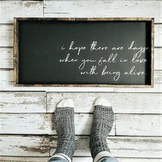 a person standing in front of a chalkboard with the words i hope there are days when you fall can leave with being alive