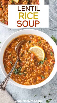 lentil rice soup in a white bowl with a spoon and lemon wedge on the side