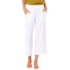 evo.com | Rip Curl Bottoms > You don't have to be on the coast to wear the Rip Curl Premium Surf Beach Pants 24/7. Once you try these flattering and flowy pants, it's unlikely you'll ever want to take them off. With an elastic waistband and pockets in the front, you'll be the definition of comfy-cute. 100% Cotton Elastic Waistband Metal Logo Trim Front Pocket Cropped Fit | Women's Rip Curl Premium Surf Beach Pants 2024 - Small White | Cotton Flowy Pants, Beach Pants, Metal Logo, Rip Curl, Metallic Logo, The Coast, Calgary, Front Pocket, White Cotton