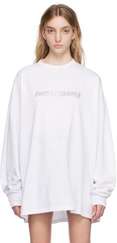 Cotton jersey T-shirt. · Rib knit crewneck · Crystal-cut logo at chest · Dropped shoulders Supplier color: White Long Sleeve Tops With Logo Lettering For Streetwear, Long Sleeve Tops With Logo Lettering In Loose Fit, Oversized Long Sleeve Tops With Logo Lettering, Oversized Crew Neck Sweatshirt With Logo Lettering, Streetwear Crew Neck Tops With Embroidered Logo, Streetwear Crew Top With Embroidered Logo, Embroidered Logo Graphic Tee With Crew Neck, Oversized White Tops With Logo Lettering, Crew Neck Graphic Tee With Embroidered Logo