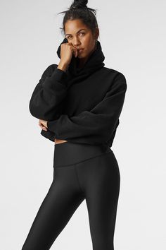 A cute and comfy counterpart to your high-waisted favorites, the Bae Hoodie has a relaxed fit, long scrunchable sleeves, ribbed cuffs and a slightly cropped ribbed hem that highlights the natural waist. The pocketless design is streamlined and bulk-free, and the French terry is an absolute pleasure to pull on: smooth on outside and fleecy on the inside. Athleisure Hoodie With Ribbed Cuffs And Funnel Neck, Black Sporty Cropped Hoodie, Cozy Stretch Hoodie For Workout, Cozy Stretch Workout Hoodie, Black Cropped Hoodie With Drawstring Hood, Alo Yoga Fall Sweats With Ribbed Cuffs, Alo Yoga Sweats With Ribbed Cuffs For Fall, Oversized Sporty Cropped Sweater With Ribbed Cuffs, Alo Yoga Fall Hoodie With Ribbed Cuffs