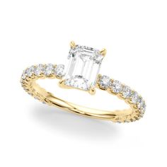 a yellow gold engagement ring with an emerald cut diamond