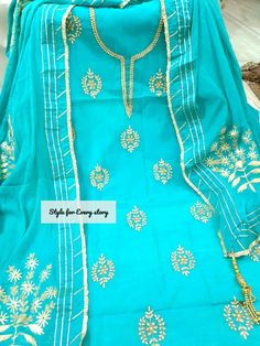 Item Overview ATHARVA Hand Embroidere Salwar Kameez in Feroze Blue w/Beautiful Embroidery Jaal/Gota Patti Dupatta/ Customized Stitching/ Wedding/ Dno. CH1434 Fabric: * Shirt: Chanderi - Feroze Blue- 2.5 Mts, with Beautiful Embroidery Neck & Jaal Embroidery * Dupatta: Chiffon Chinnon Dupatta w/Gota Patti work * Salwar: Santoon Silk 2.5 Mts. Excusive Hand Embroidered Party Wear Punjabi Suit. Customization: * Fabrics: Designs Can be made in different Fabrics. * Stitching Available Care: * Dry Clean Semi-stitched Embroidered Blue Anarkali Set, Blue Chinon Lawn Suit For Festive Occasions, Festive Blue Chinon Lawn Suit, Unstitched Light Blue Lawn Suit For Wedding, Blue Dola Silk Unstitched Wedding Suit, Blue Dola Silk Unstitched Suit For Wedding, Blue Georgette Lawn Suit For Festivals, Blue Bollywood Lawn Suit With Traditional Drape, Blue Anarkali Lawn Suit For Wedding