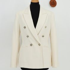 Blazer With Lapel Collar And Long Sleeves With Shoulder Pads. Front Welt Pockets. Back Vent. Front Double Breasted Closure With Embossed Gold Buttons. Elegant Cream Double-breasted Blazer, Elegant Cream Blazer With Buttons, Elegant Zara Blazer For Business, Zara Cream Formal Blazer, Elegant Cream Zara Blazer, Tailored Cream Zara Blazer, Zara Tailored Cream Blazer, Zara Cream Blazer For Work, Zara Elegant Outerwear With Suit Collar