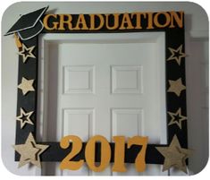 a door decorated with gold stars and graduation decorations