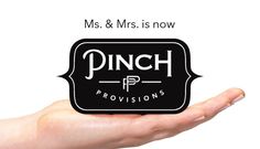 a person holding up a business card with the word pinch on it in front of them