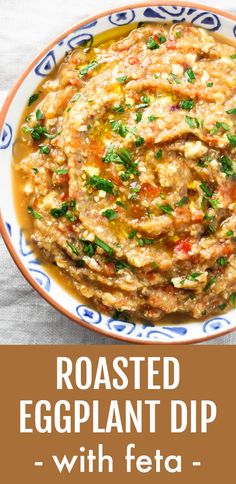 roasted eggplant dip with feta in a blue and white bowl on a table