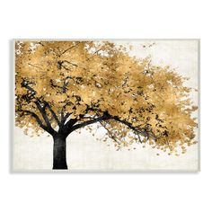 an art print of a tree with yellow leaves on it's branches in a gold and white frame