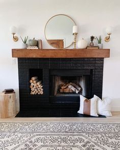 the fireplace is decorated with candles and decorative items