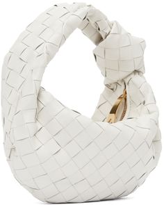 Intrecciato-woven grained lambskin and calfskin top handle bag in white. · Integrated carry handle with knotted detailing · Zip closure · Tonal leather lining · Gold·-tone hardware · H8 x W10 x D3 in Supplier color: White Designer Top Handle Shoulder Bag With Interwoven Design, Luxury White Shoulder Bag With Intrecciato Weave, Luxury White Intrecciato Weave Shoulder Bag, Designer White Bags With Intrecciato Weave, White Woven Leather Evening Shoulder Bag, Designer White Shoulder Bag With Braided Handles, Luxury White Woven Leather Shoulder Bag, White Top Handle Bag With Intrecciato Weave, Designer White Shoulder Bag With Woven Leather